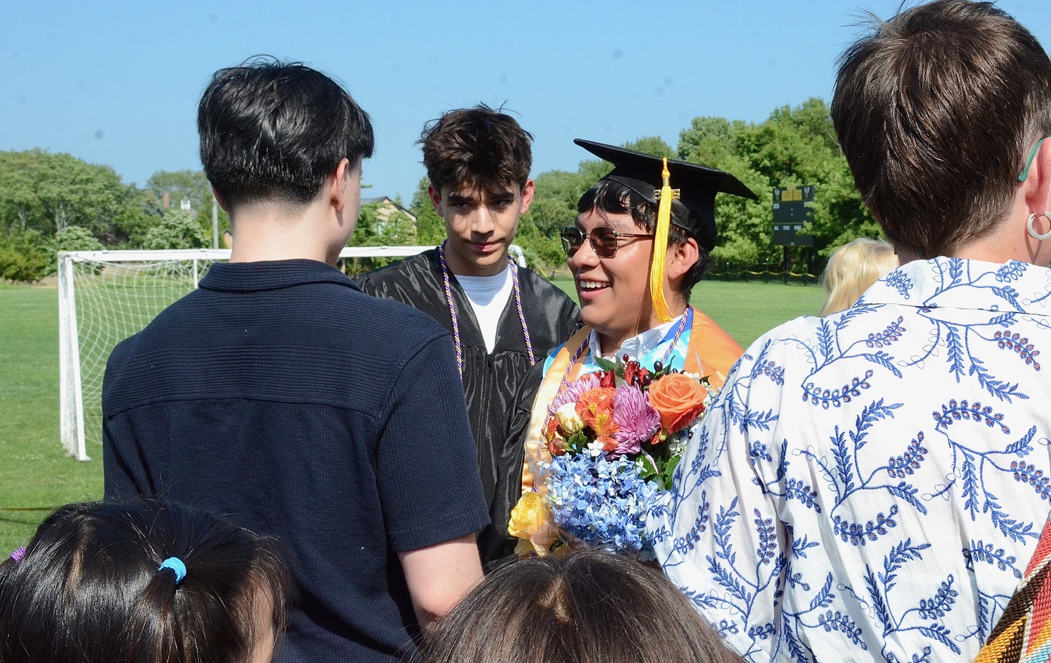 Graduates celebrate with friends and family after the ceremony.  KYRIL BROMLEY
