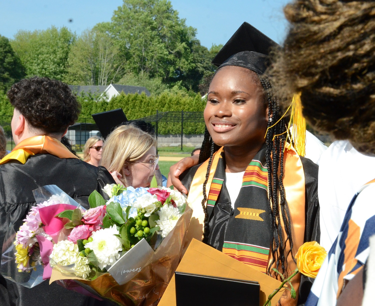 Graduates celebrate with friends and family after the ceremony.  KYRIL BROMLEY
