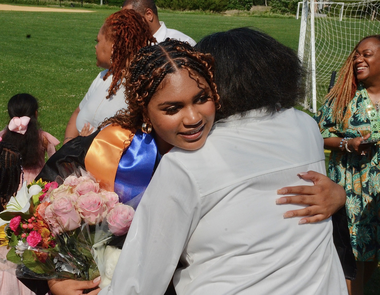 Graduating senior Aiyanna Spears hugs a loved one.  KYRIL BROMLEY