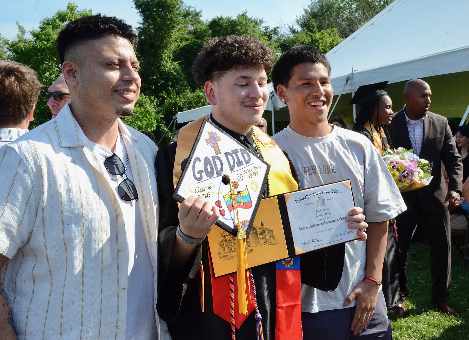 Graduates celebrate with friends and family after the ceremony.  KYRIL BROMLEY