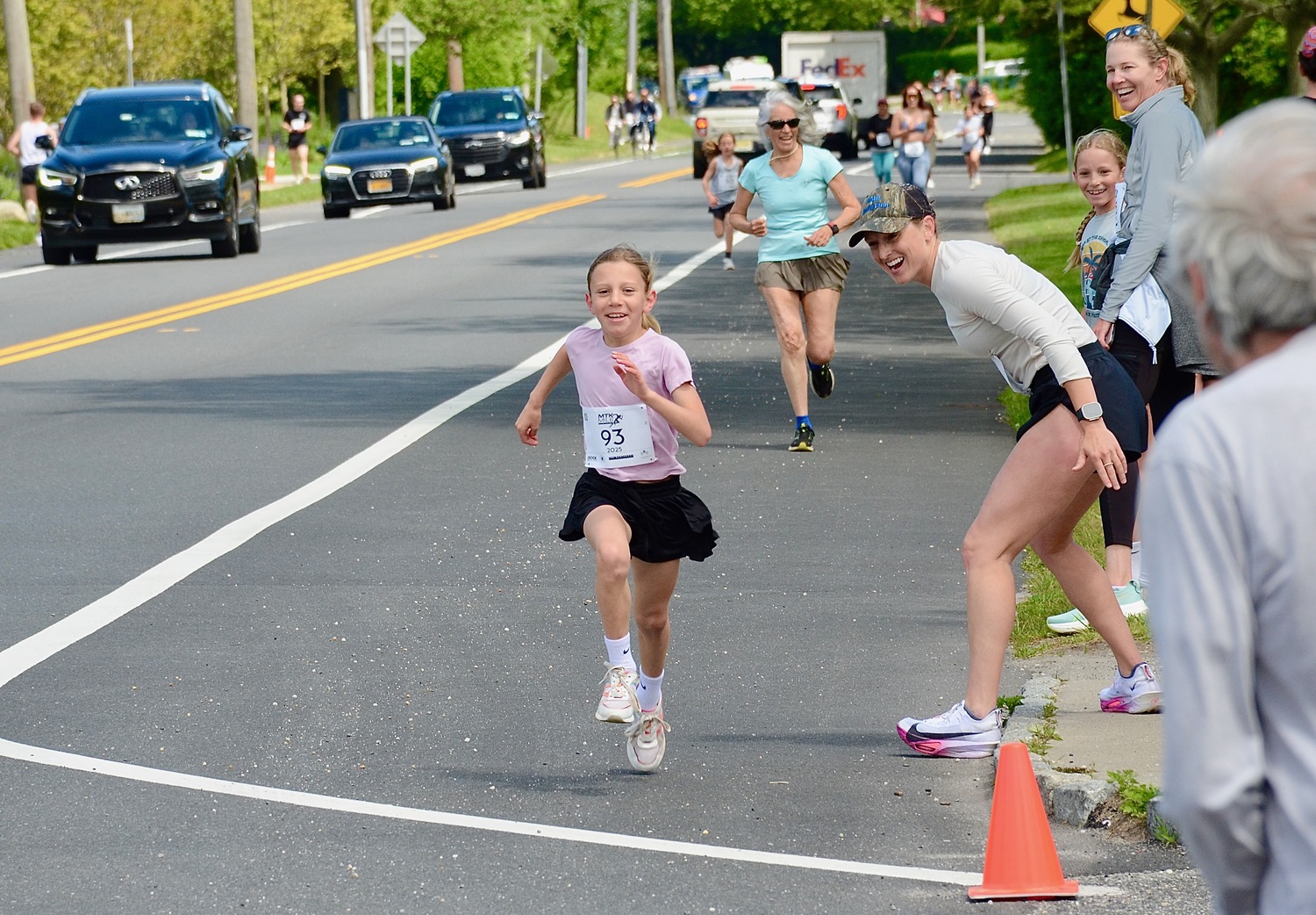 Zoe Powers, 8, of East Hampton races toward the finish line.   KYRIL BROMLEY