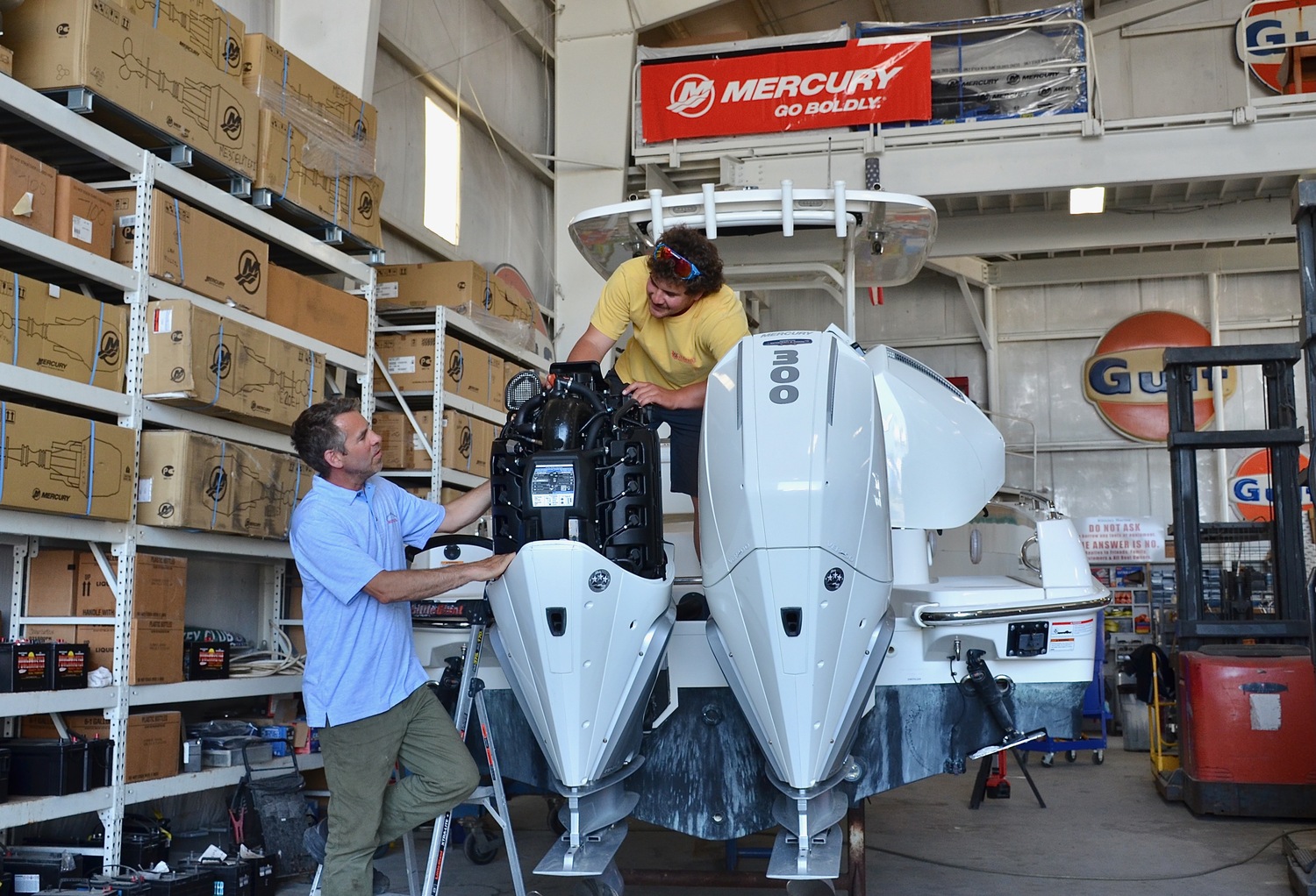 Head mechanic Jeremy Somero (blue shirt) and fellow mechanic John Rutkowski. KYRIL BROMLEY PHOTOS