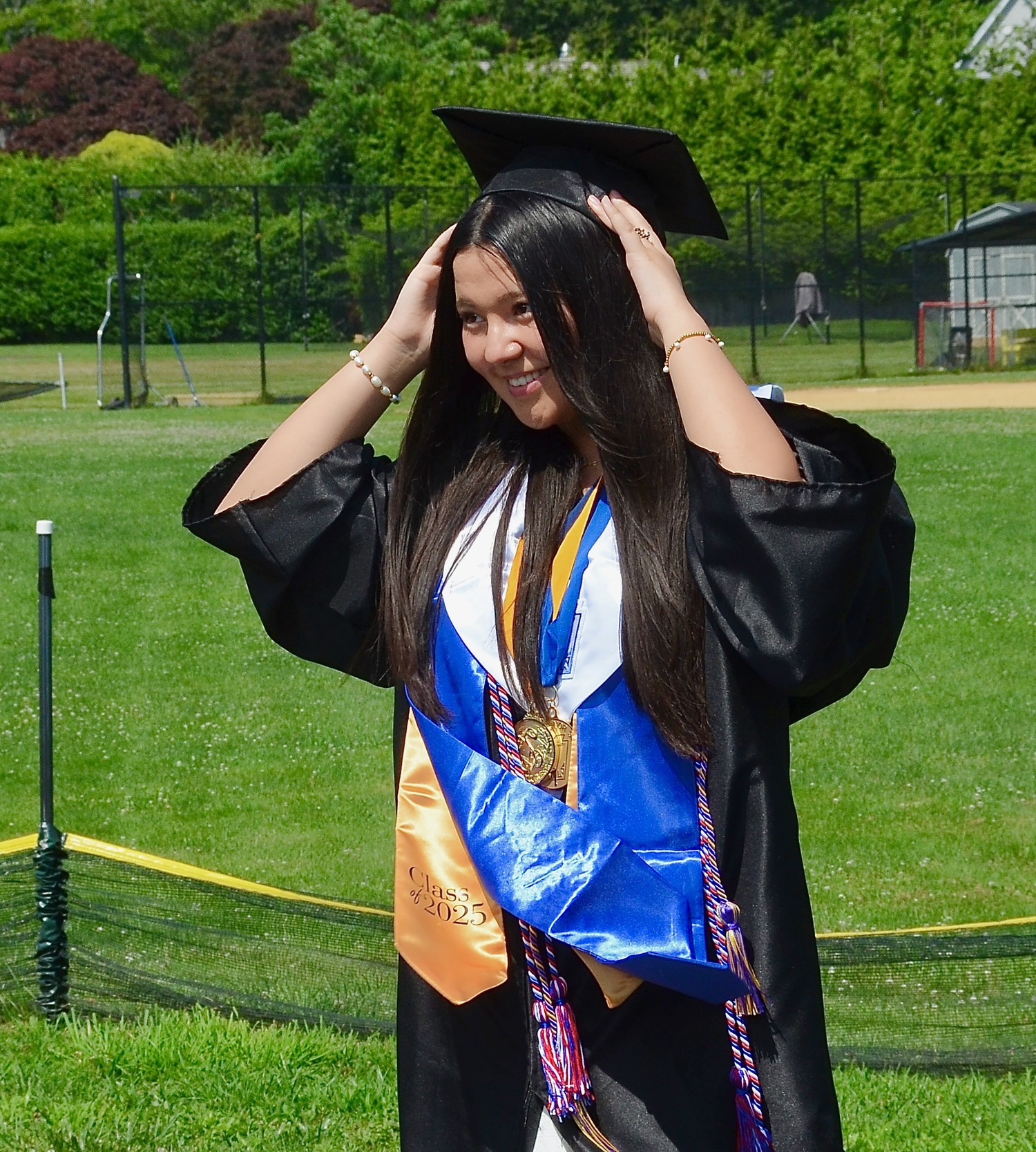 Graduates celebrate with friends and family after the ceremony.  KYRIL BROMLEY