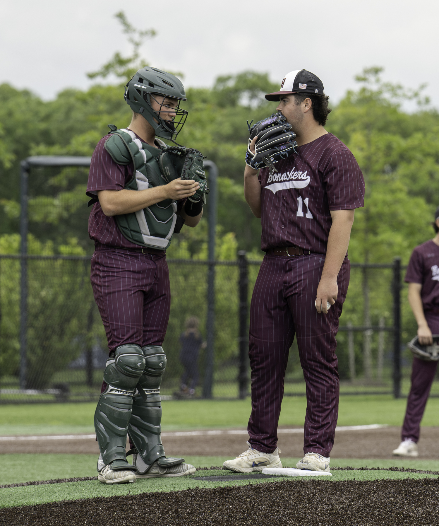 Bonac batter mates Carter Dickinson, left, and Trevor Meehan discus things on the mound.  MARIANNE BARNETT