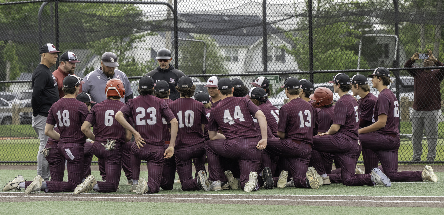 Henry Meyer and the rest of the Bonac coaching staff meet with the players after their 4-0 loss to East Islip in the county final on Saturday.  MARIANNE BARNETT