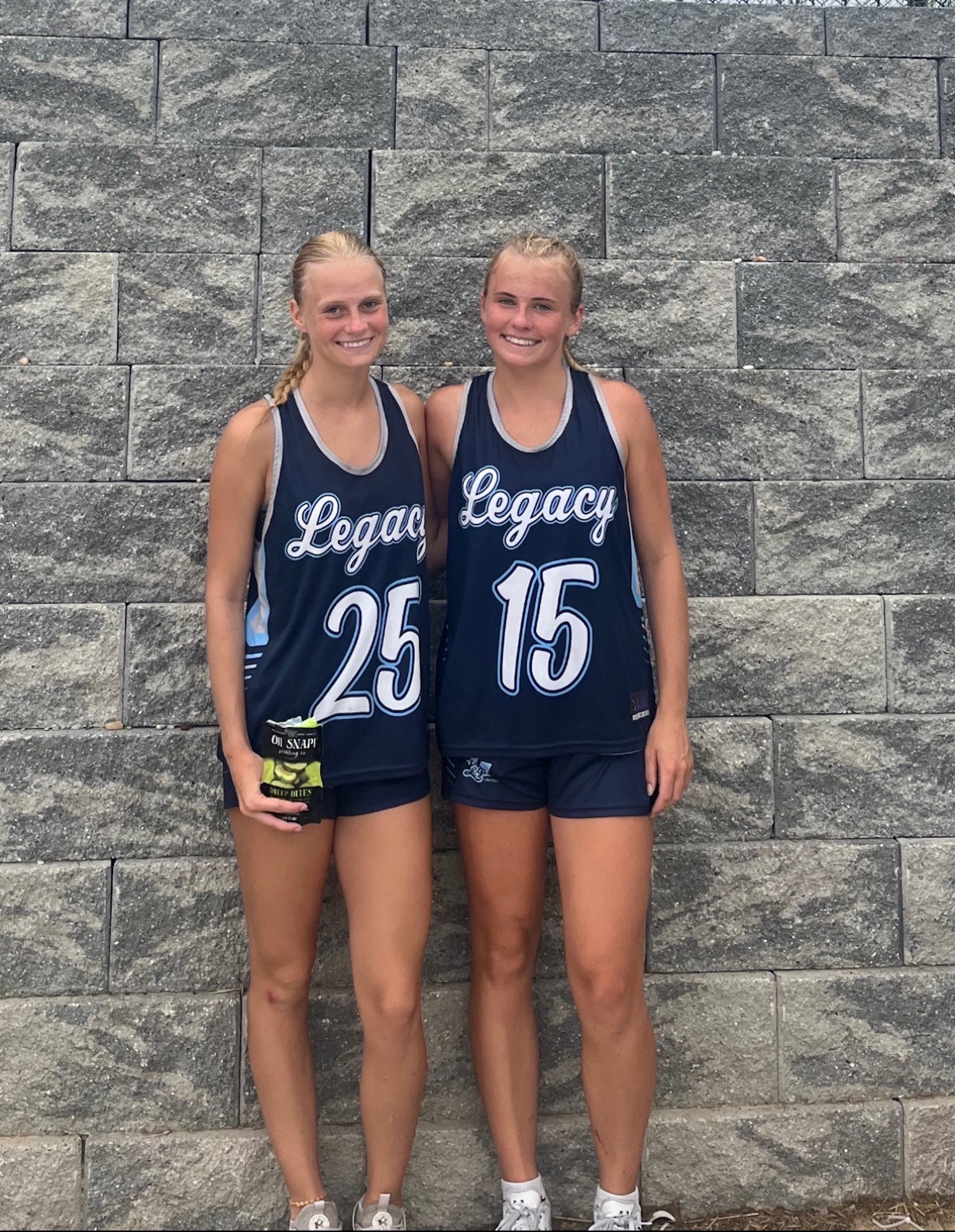 Hampton Bays juniors Eden Brown and Taylor Meyers at the Mid-Atlantic Summer Club Lacrosse Championships as members of Bohemia-based Legacy Lacrosse. COURTESY EDEN BROWN