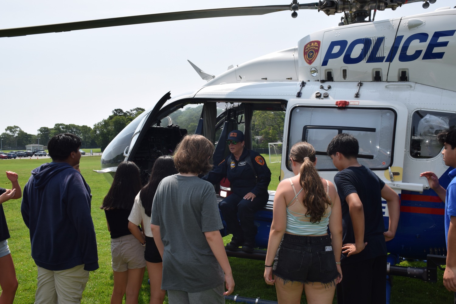 Hampton Bays Middle School students recently celebrated Local Heroes Day. As part of the day, local law enforcement officers visited the school and spoke to students about the different kinds of police jobs, including those related to the SWAT team, K-9 unit and helicopter unit. Students also learned about police drones and safety and watched a police helicopter land. COURTESY HAMPTON BAYS SCHOOL DISTRICT