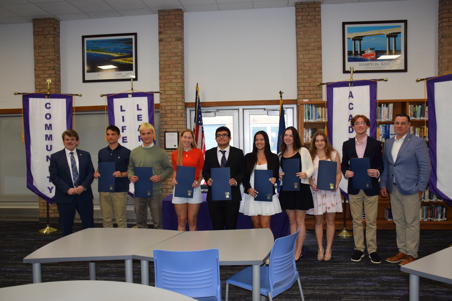 Senator Anthony Palumbo and Assemblyman Tommy Schiavoni paid tribute to Class of 2025 valedictorians and salutatorians from six East End schools during an annual ceremony at Hampton Bays High School on May 30.
The top-ranking seniors were presented with proclamations for their hard work and
dedication. They represented the Bridgehampton, East Hampton, Hampton Bays, Sag Harbor, Shoreham-Wading River and Westhampton Beach school districts.
The students heard firsthand from Sen. Palumbo and Assemblyman Schiavoni about
their careers. In turn, the seniors shared stories about their journeys through high school,
their passions and their plans for the future.
Friends, family members, school administrators and the guests of honor also
enjoyed a brunch prepared by Hampton Bays High School culinary students. COURTESY HAMPTON BAYS SCHOOL DISTRICT