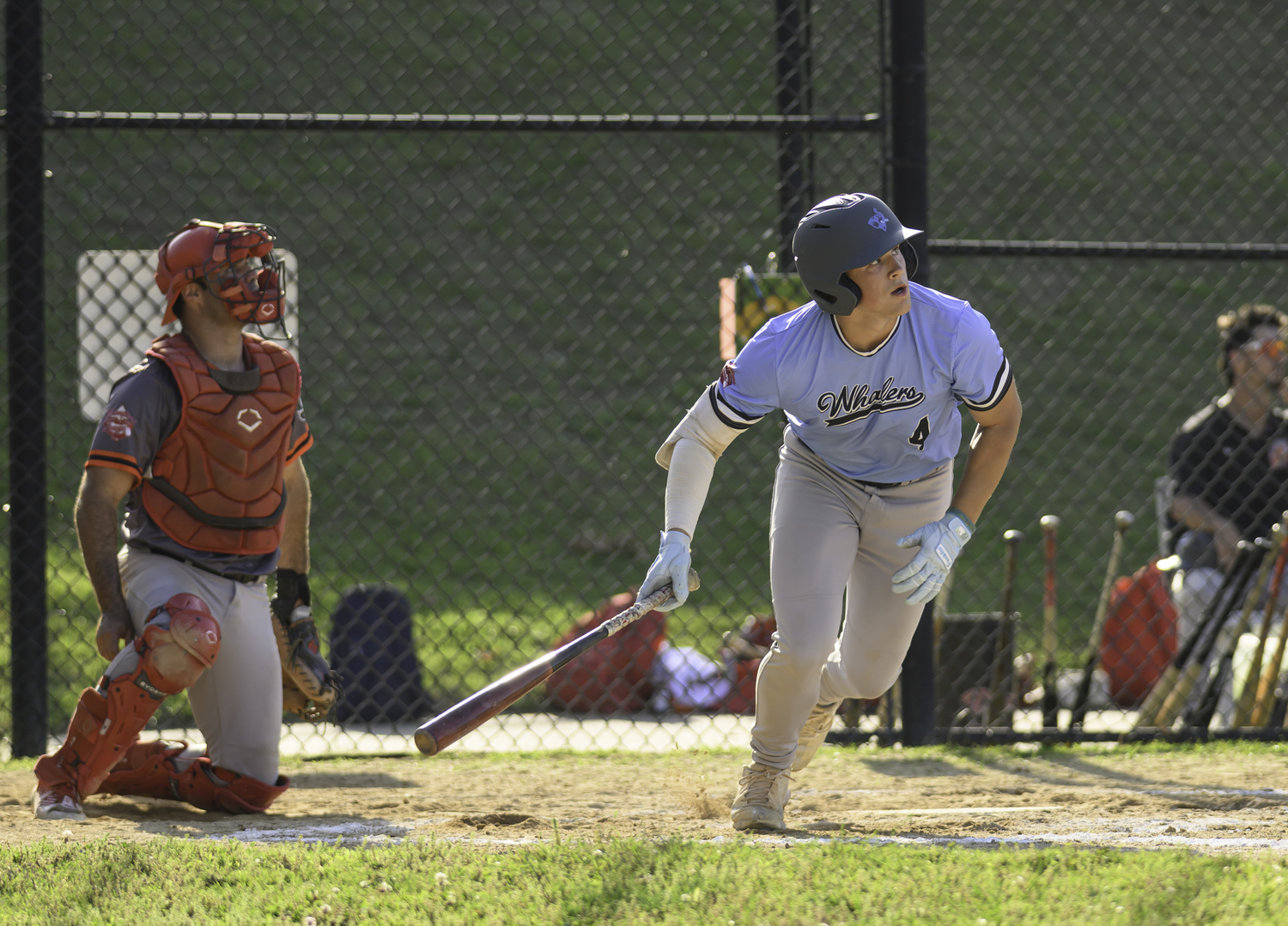 Sag Harbor's Derek Desmarais (Tufts) watches his base hit fall in to bring home a run.  MARIANNE BARNETT