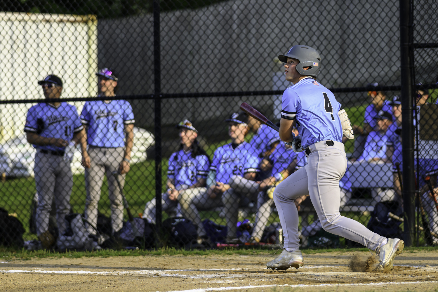 Sag Harbor's Derek Desmarais (Tufts) watches his base hit fall in to bring home a run.  MARIANNE BARNETT