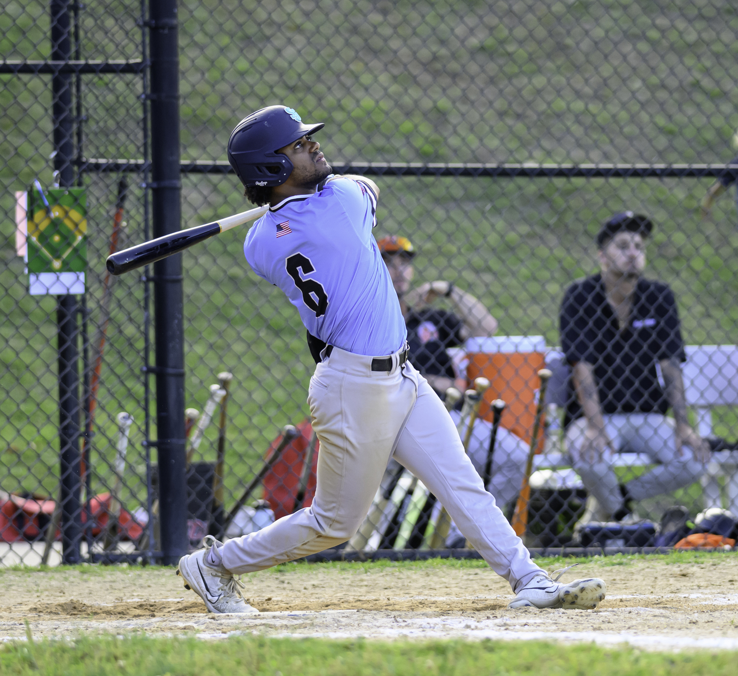 Dylan Kennedy-Fujah (St. John's University) watches his two-run home run go over the fence in the bottom of the fifth inning to put the finishing touches on the win.  MARIANNE BARNETT