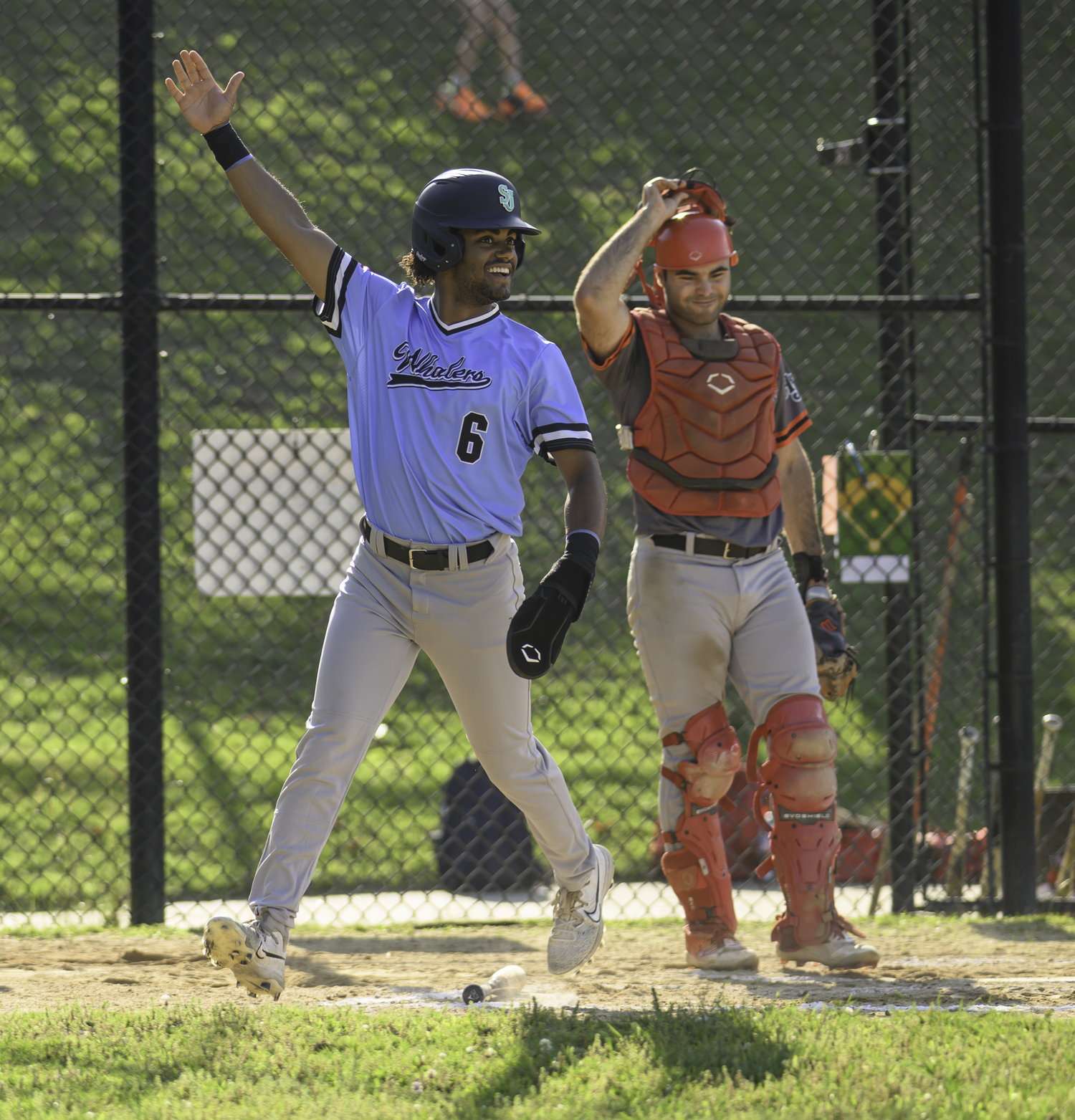 Dylan Kennedy-Fujah (St. John's University) scores the first run of Tyler Sirchia's grand slam.  MARIANNE BARNETT