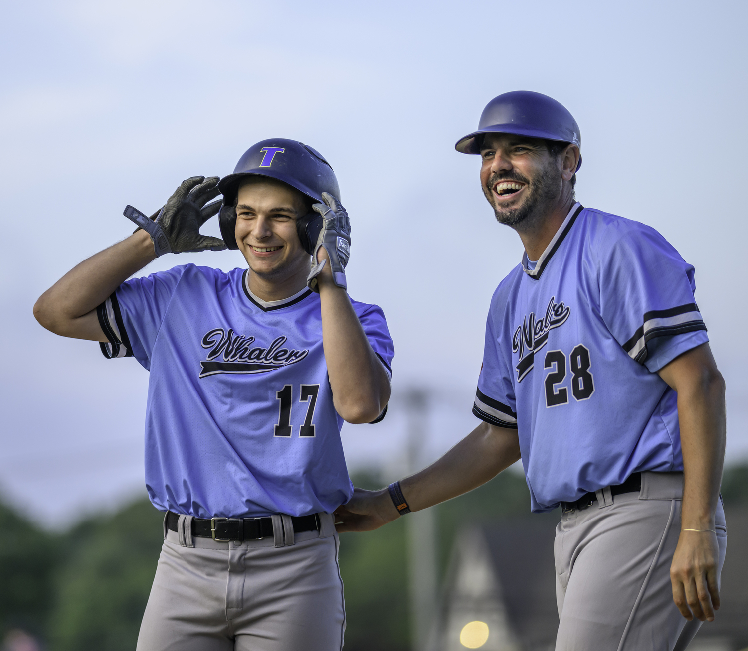 Eric Wallick, left, and first base coach Braeden Schlehuber are all smiles in what wound up being a big win for the Whalers.  MARIANNE BARNETT