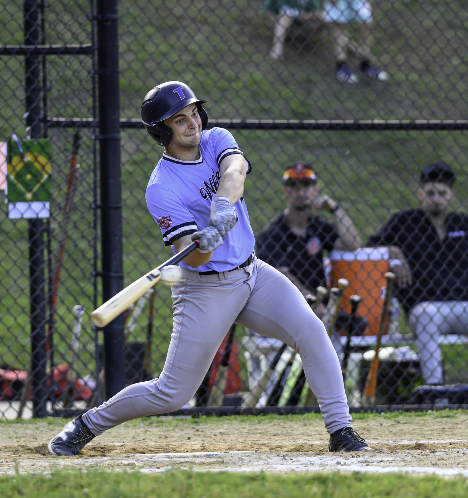 Eric Wallick (Tufts) hits the ball.  MARIANNE BARNETT