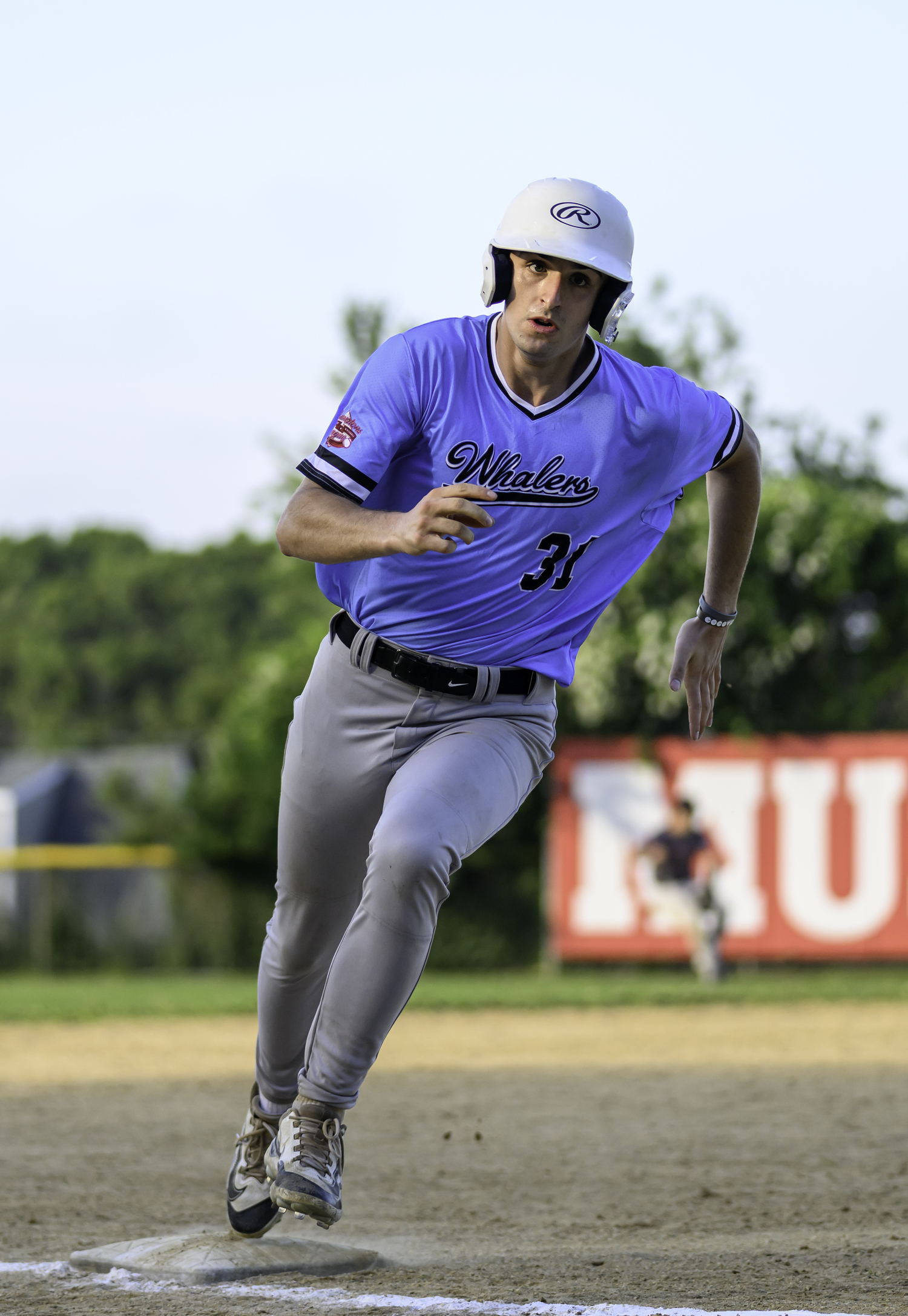 Tyler Sirchia (Dartmouth) is greeted at home plate after hitting a grand slam.  MARIANNE BARNETT