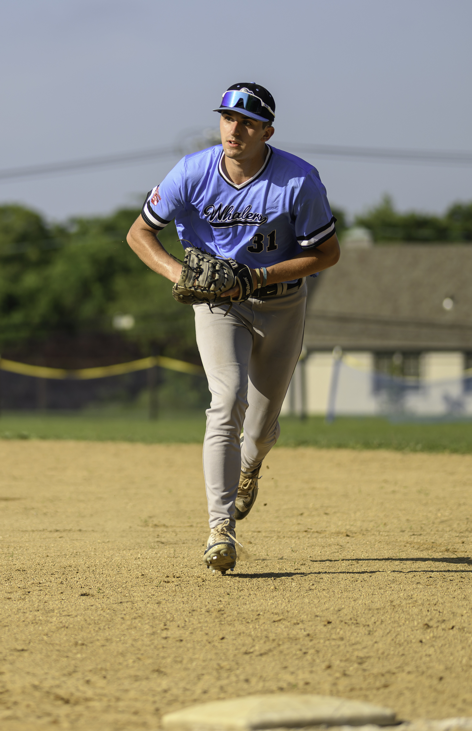 Tyler Sirchia heads to first base for an out after fielding a ground ball.  MARIANNE BARNETT