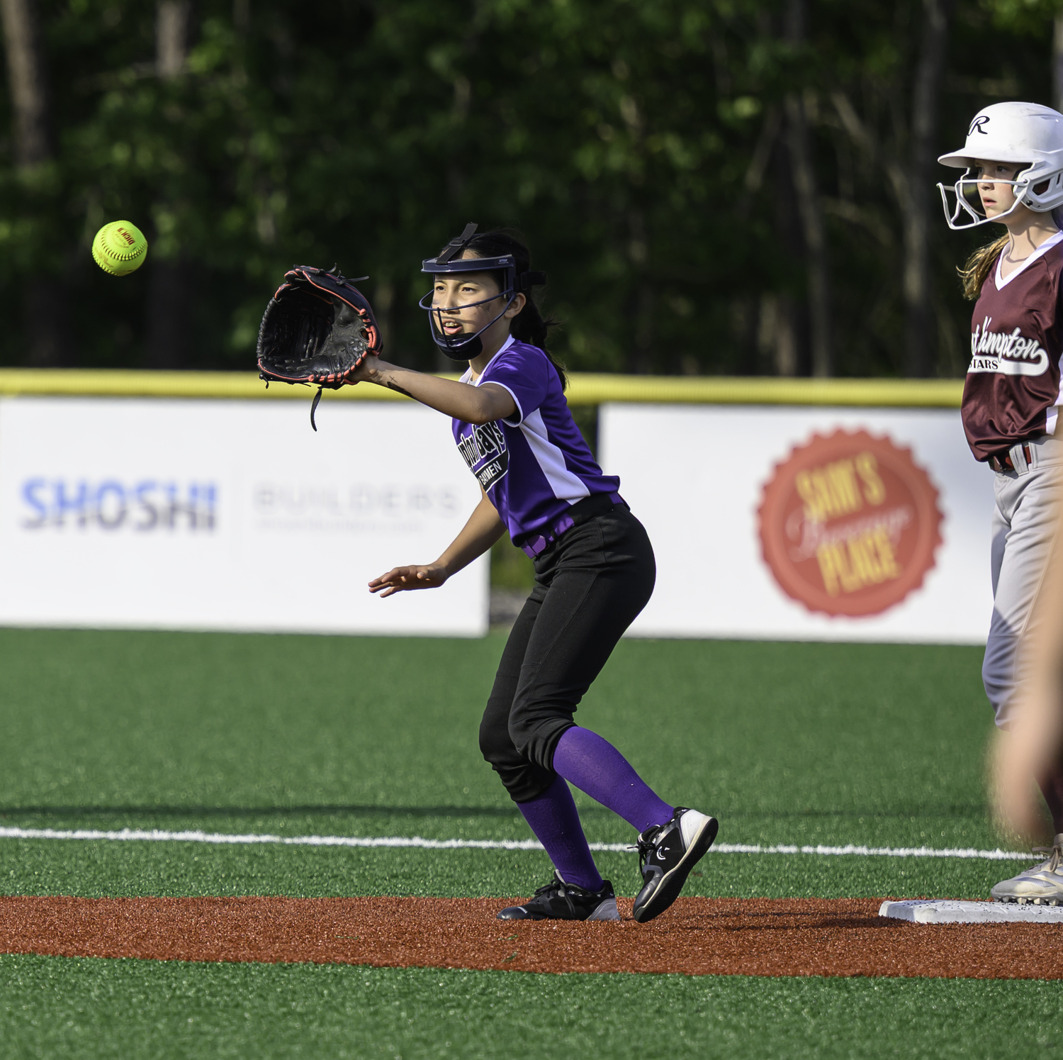 The Hampton Bays 12-and-under softball team played East Hampton at the Hon. Fred W. Thiele, Jr. Recreational Facility at Stephen Hands Path on Monday.  MARIANNE BARNETT