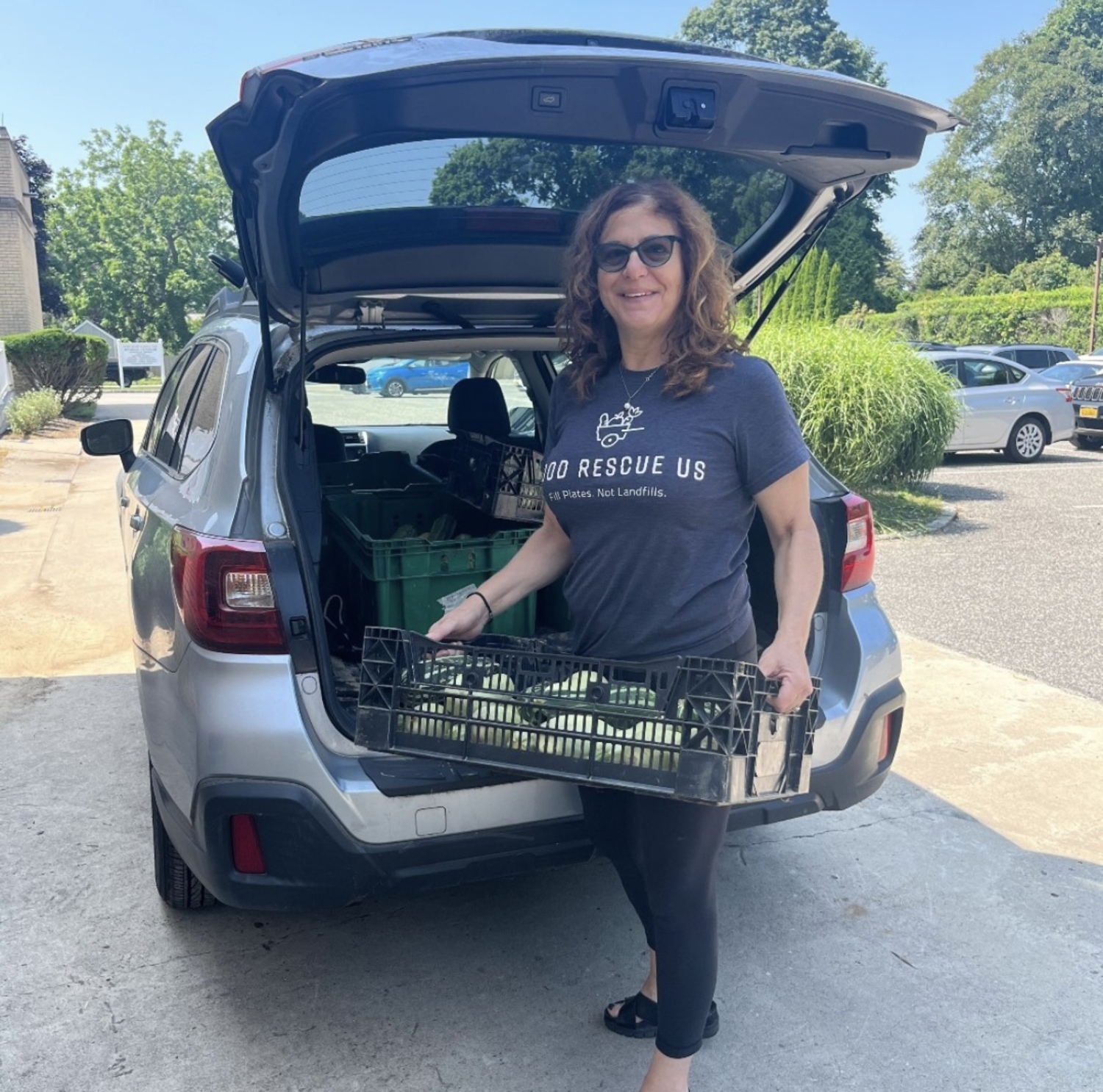 A volunteer with the South Fork chapter of Food Rescue US unload crates of vegetables at the Springs Food Pantry. Food Rescue US- South Fork photo