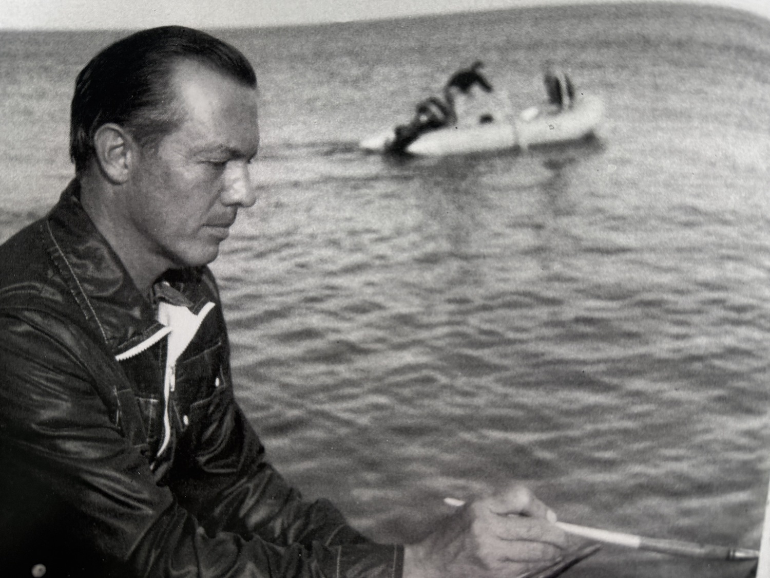 Nelson H. White at work on a painting as a young man. COURTESY GRENNING GALLERY