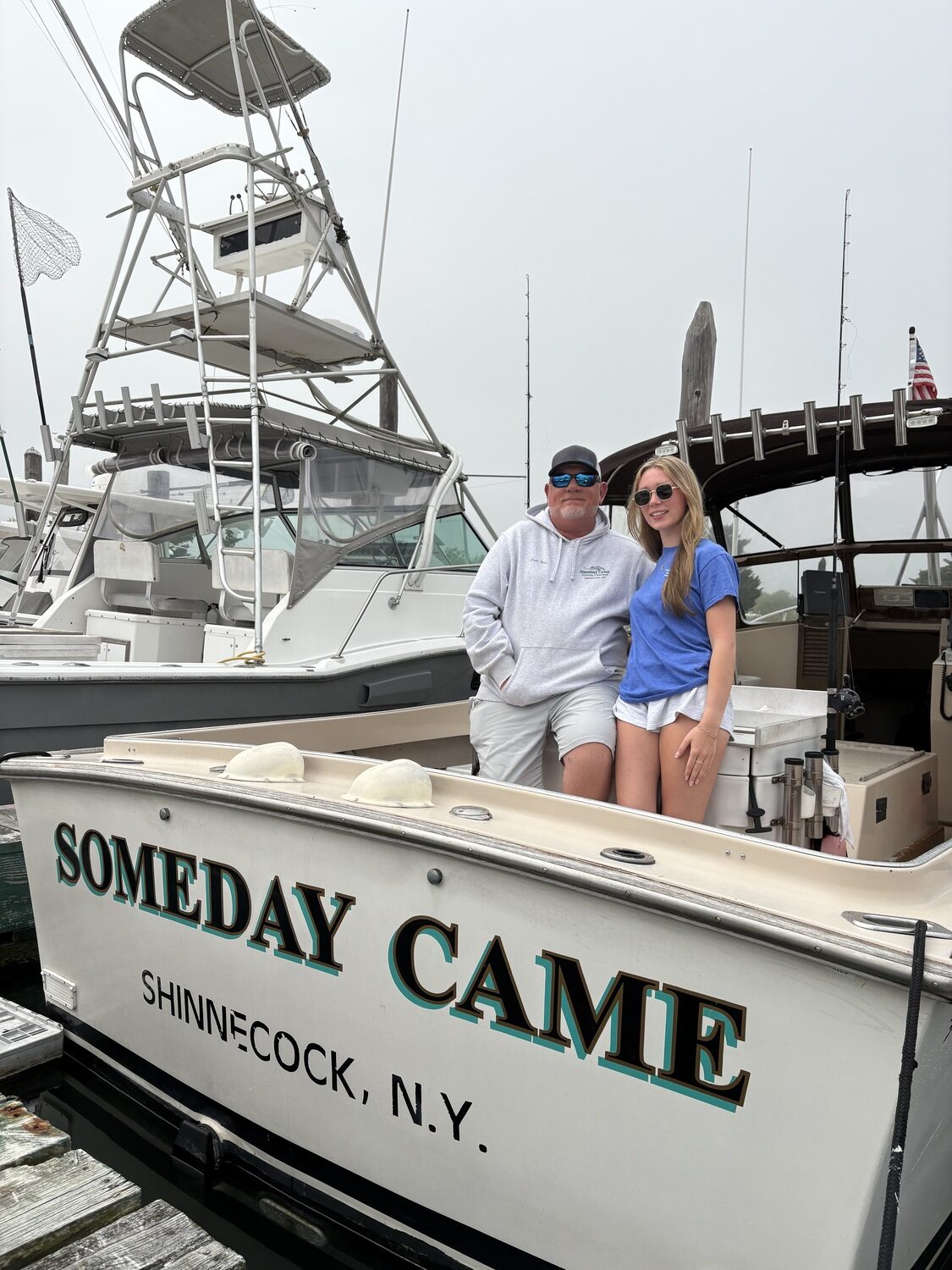 Captain Brad Ries and his daughter and first mate, Charleigh Ries, aboard his charter boat, Someday Came, in Hampton Bays. CAILIN RILEY