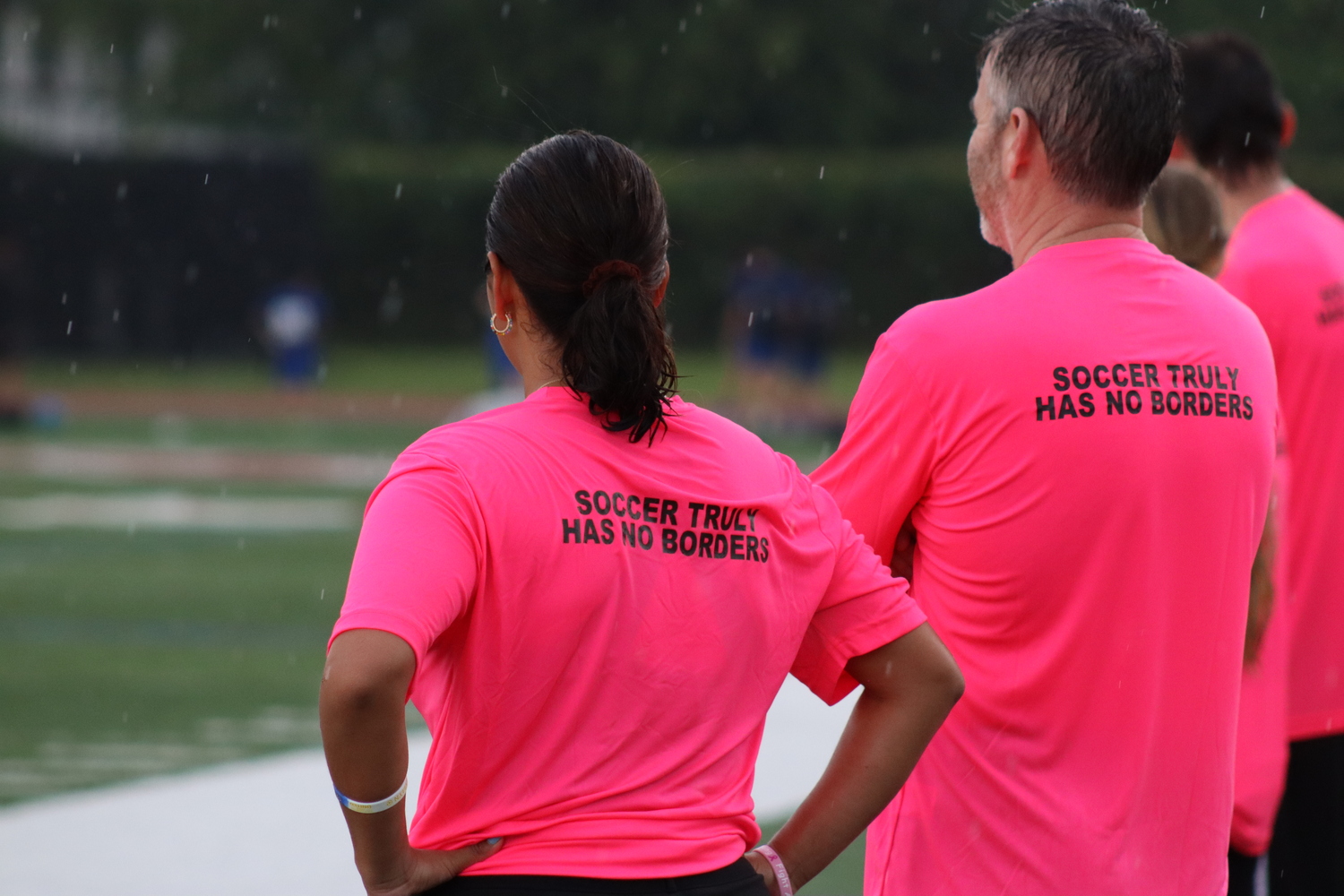 The coaching staff wore pink shirts with a simple message for the game. CAILIN RILEY
