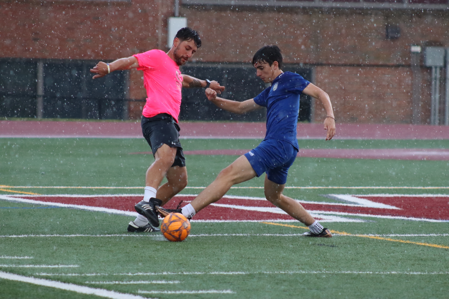 Coach Irvin Zuzic squares off against 2007 player [NAME]. CAILIN RILEY