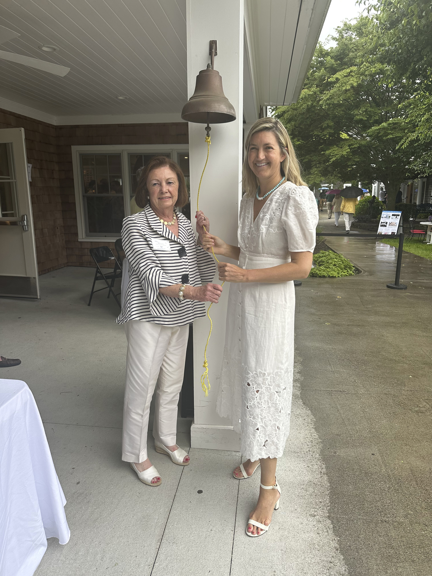 Ann Yawney and Florence Danforth ringing the bell to start the shopping at the DDD event.
