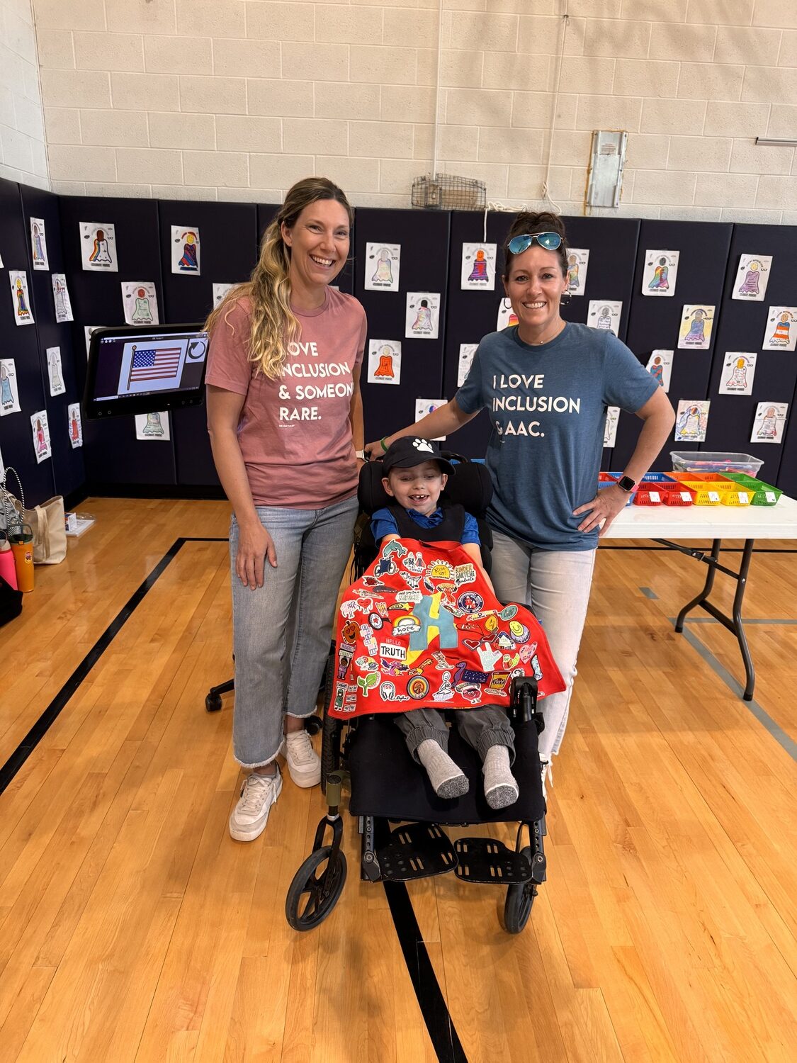 East Quogue second-grader Hunter Gladding with his homeschool teacher, Becky Mignone (left) and communication therapist, Meg Kretz. COURTESY EAST QUOGUE SCHOOL