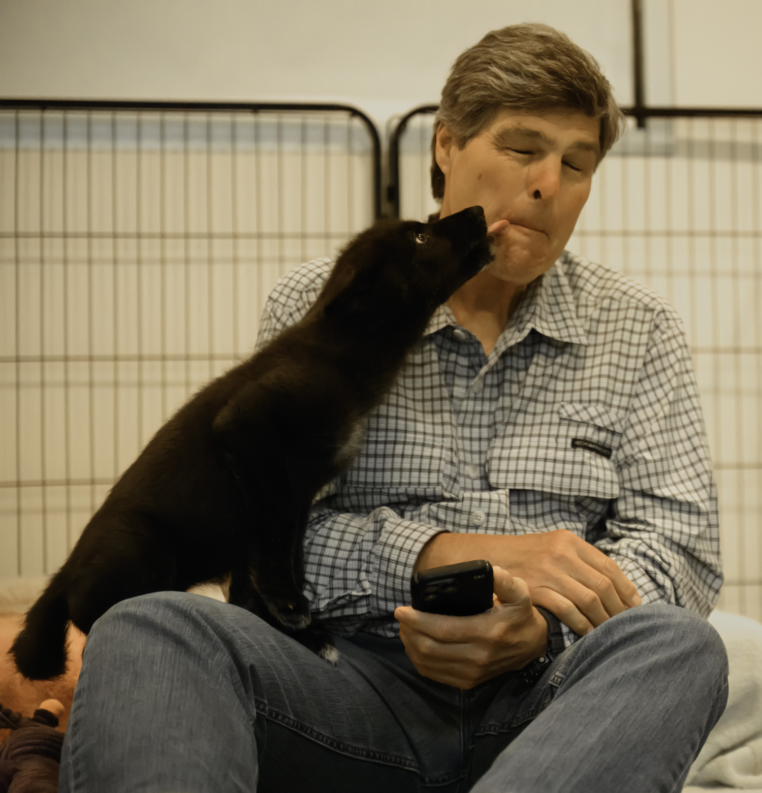 The young pup kisses my husband Michael.  MARIANNE BARNETT