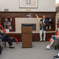 Southampton Village Mayor Bill Manger cuts the ribbon at the Rogers Memorial Library on Saturday.  RON ESPOSITO
