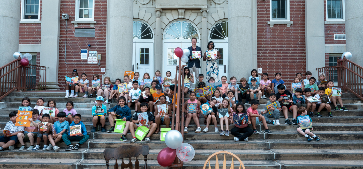 To inspire students to read throughout the summer, Southampton School District
Superintendent Dr. Fatima Morrell kicked off a new Superintendent’s Summer Reading
Program on June 23 on the steps of Southampton Elementary School.
During the kickoff, Dr. Morrell, along with Southampton Village Mayor William
Manger Jr., read “I’m Gonna Like Me” by Jamie Lee Curtis and drummed up support for the
new reading program. Students in kindergarten through eighth grade can participate in the program by reading and logging books to win prizes including bicycles, roller skates, beach toys, movie tickets and gift cards. The program continues through August 15, when winners will be announced. COURTESY SOUTHAMPTON SCHOOL DISTRICT