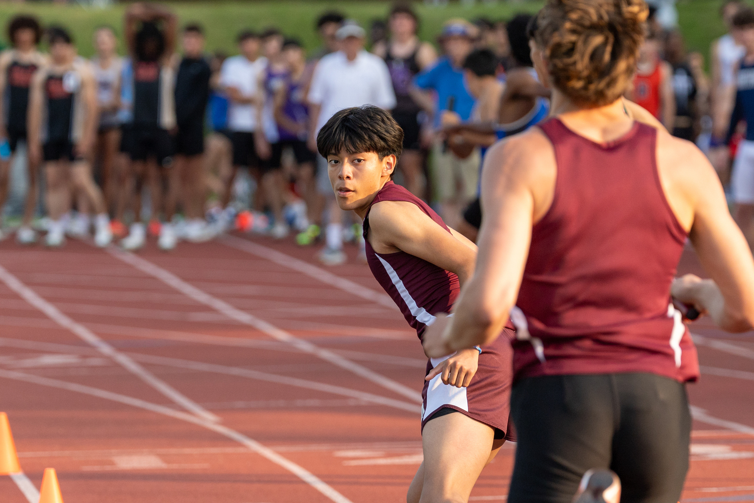 Southampton sophomore Gael Rojas looks for the baton from Hudson Fox.  RON ESPOSITO