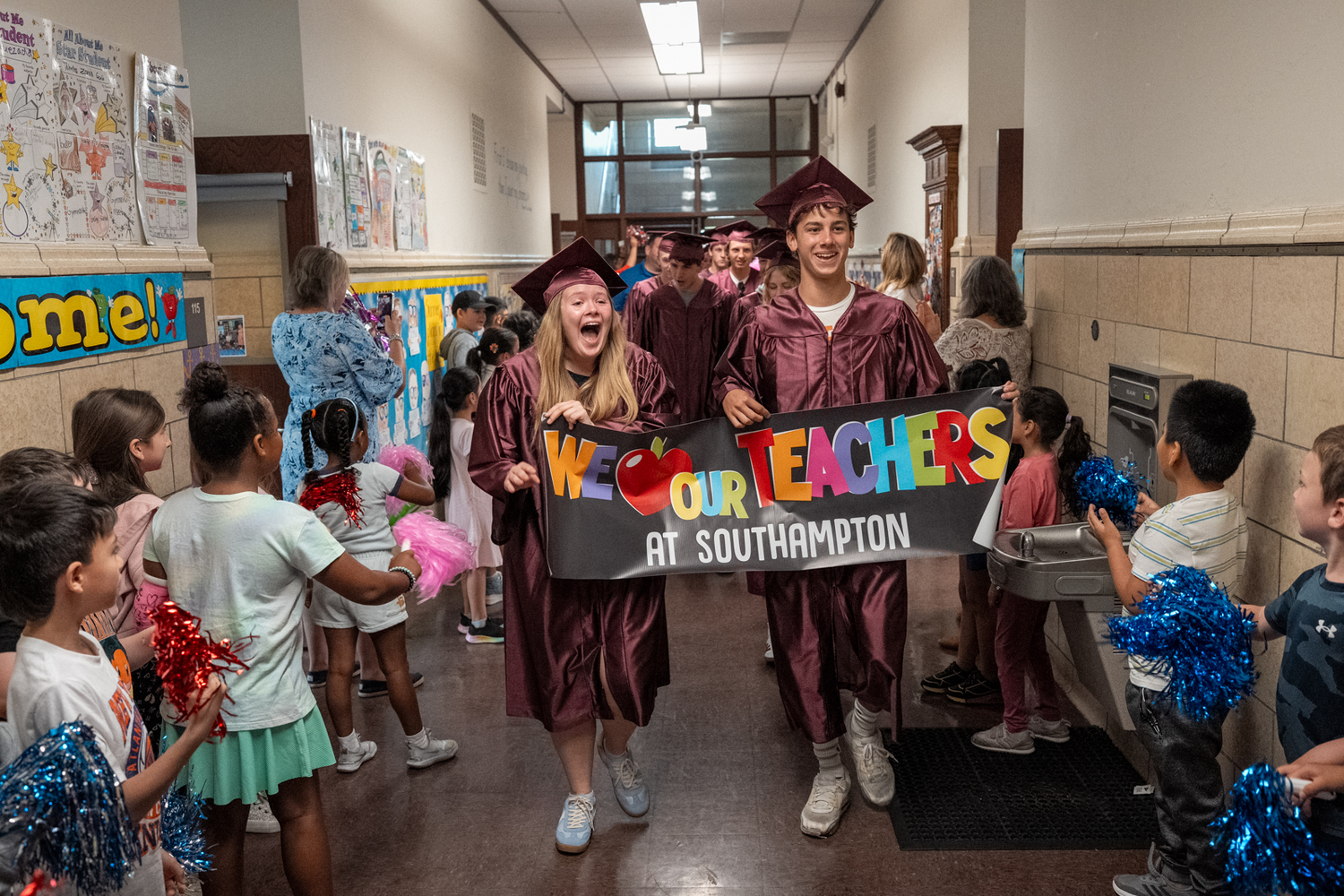 Wearing their graduation caps and gowns, members of the Southampton High School Class of 2025 walked through the halls of their former elementary schools, Southampton Elementary and Tuckahoe School, as well as Southampton Intermediate School. As they took the traditional senior walk, students cheered, clapped and held up signs of congratulations. COURTESY SOUTHAMTPON SCHOOL DISTRICT