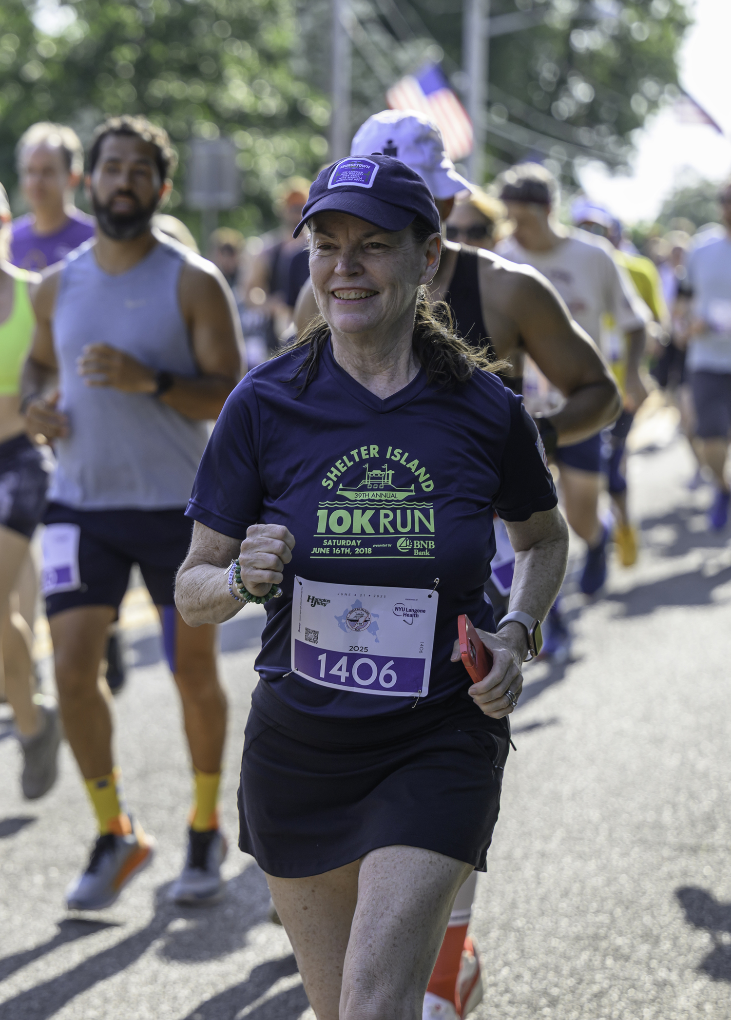 Shelter Island's own Helen Carey O’Neill participates in the Shelter Island 10K donning this year's race T-shirt.  MARIANNE BARNETT