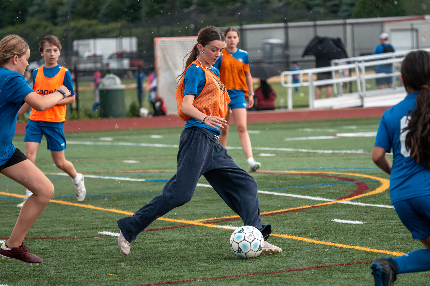 Southampton Town United players, parents and coaches gathered at Southampton High School on Friday night for the club's annual soccer festival. The club includes players from age 3 to 18, and had 26 travel teams compete in the Long Island Junior Soccer League this spring. The festival's main event, a game on the turf featuring the oldest club team, with players born in 2007, against coaches in the club, was named in honor of former coach Sean Collins this year. Collins died on May 2 after a battle with cancer. RON ESPOSITO