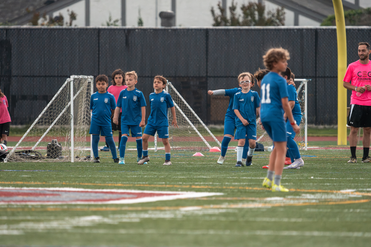 Southampton Town United players, parents and coaches gathered at Southampton High School on Friday night for the club's annual soccer festival. The club includes players from age 3 to 18, and had 26 travel teams compete in the Long Island Junior Soccer League this spring. The festival's main event, a game on the turf featuring the oldest club team, with players born in 2007, against coaches in the club, was named in honor of former coach Sean Collins this year. Collins died on May 2 after a battle with cancer. RON ESPOSITO