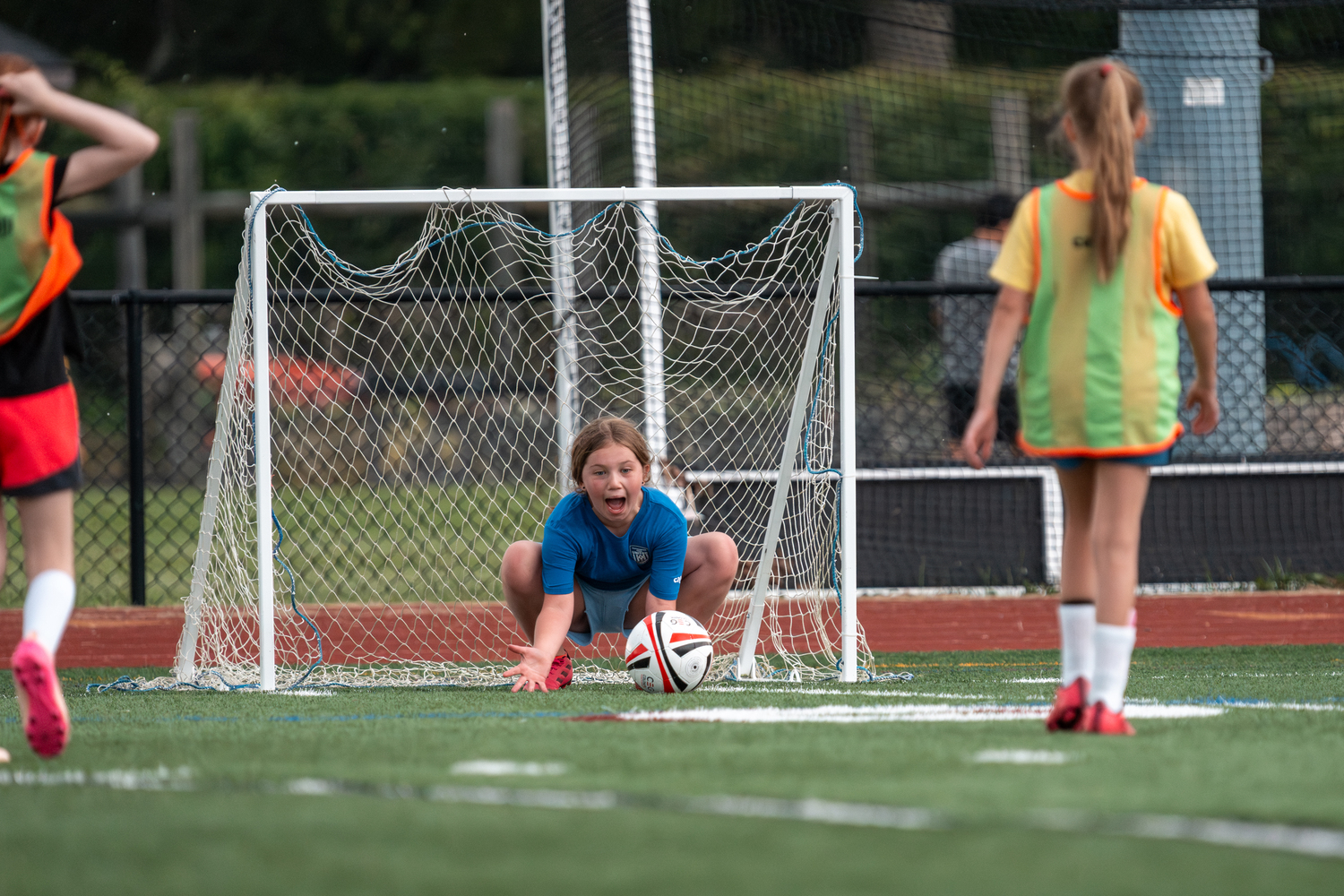 Southampton Town United players, parents and coaches gathered at Southampton High School on Friday night for the club's annual soccer festival. The club includes players from age 3 to 18, and had 26 travel teams compete in the Long Island Junior Soccer League this spring. The festival's main event, a game on the turf featuring the oldest club team, with players born in 2007, against coaches in the club, was named in honor of former coach Sean Collins this year. Collins died on May 2 after a battle with cancer. RON ESPOSITO