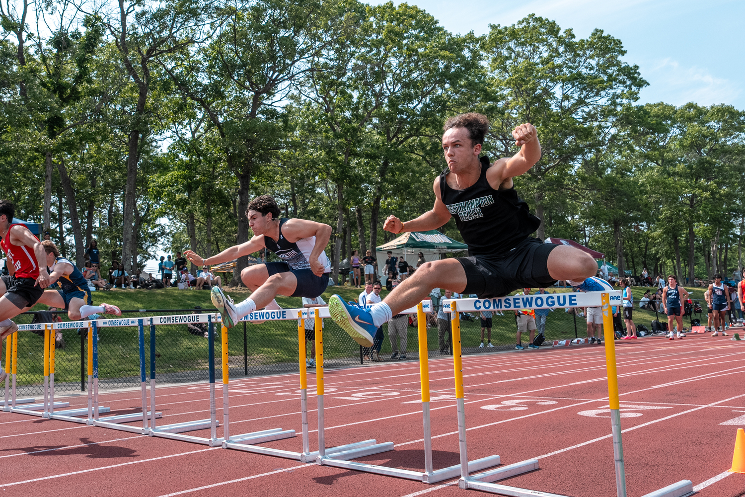 Westhampton Beach senior Ezekiel McCrary in the 100-meter hurdles of the pentathlon.  RON ESPOSITO