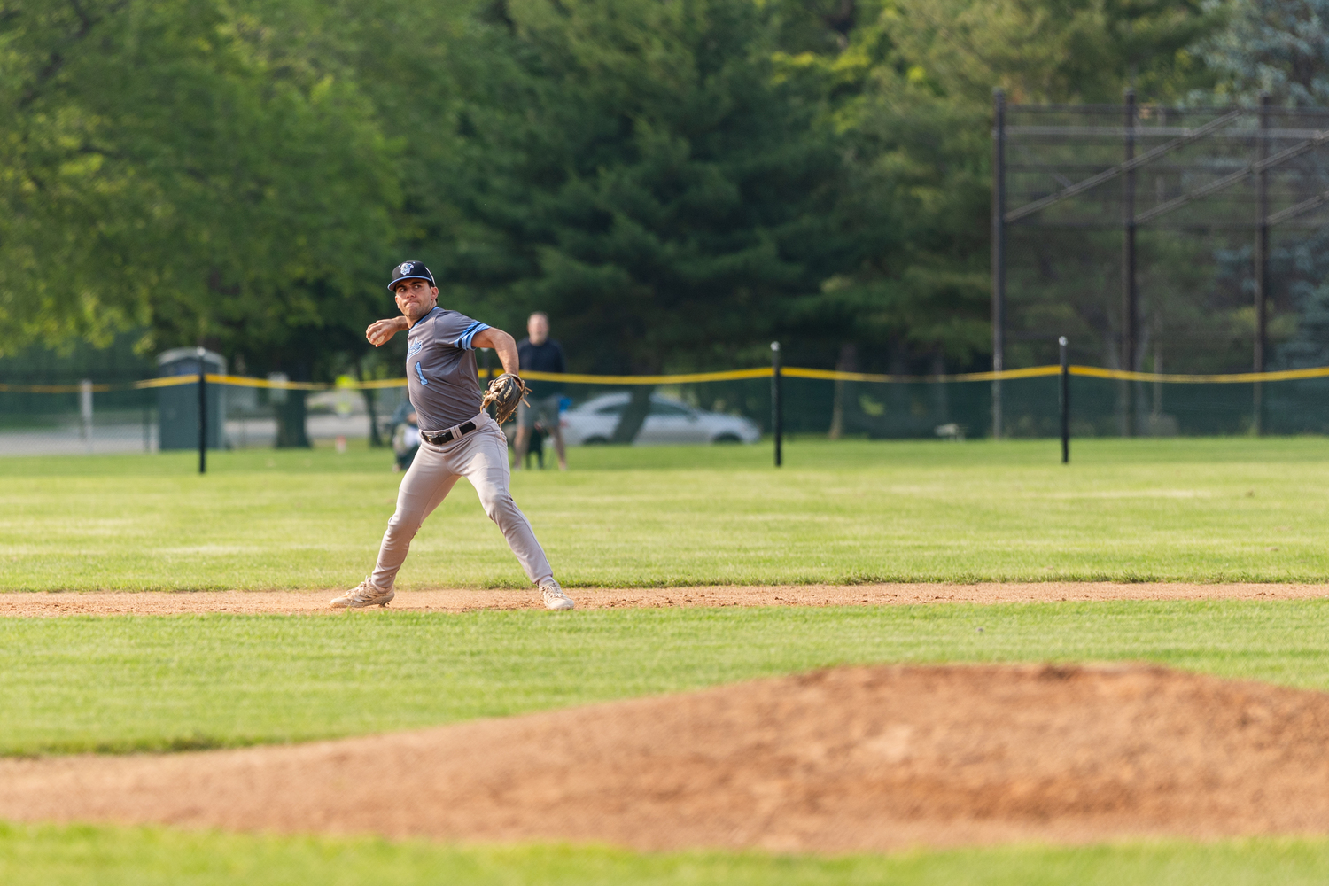 Sag Harbor's Ethan Righter (Hamilton) looks to throw across the diamond for an out.  RON ESPOSITO