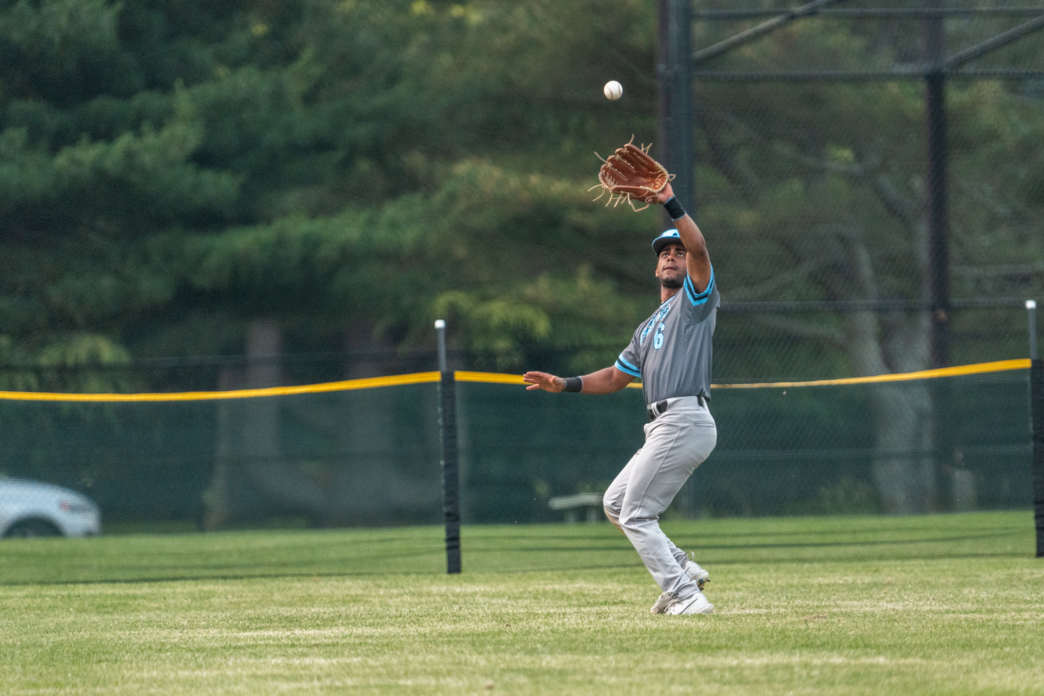 Sag Harbor's Dylan Kennedy-Fujah (St. John's University) catches a fly ball in center field.  RON ESPOSITO
