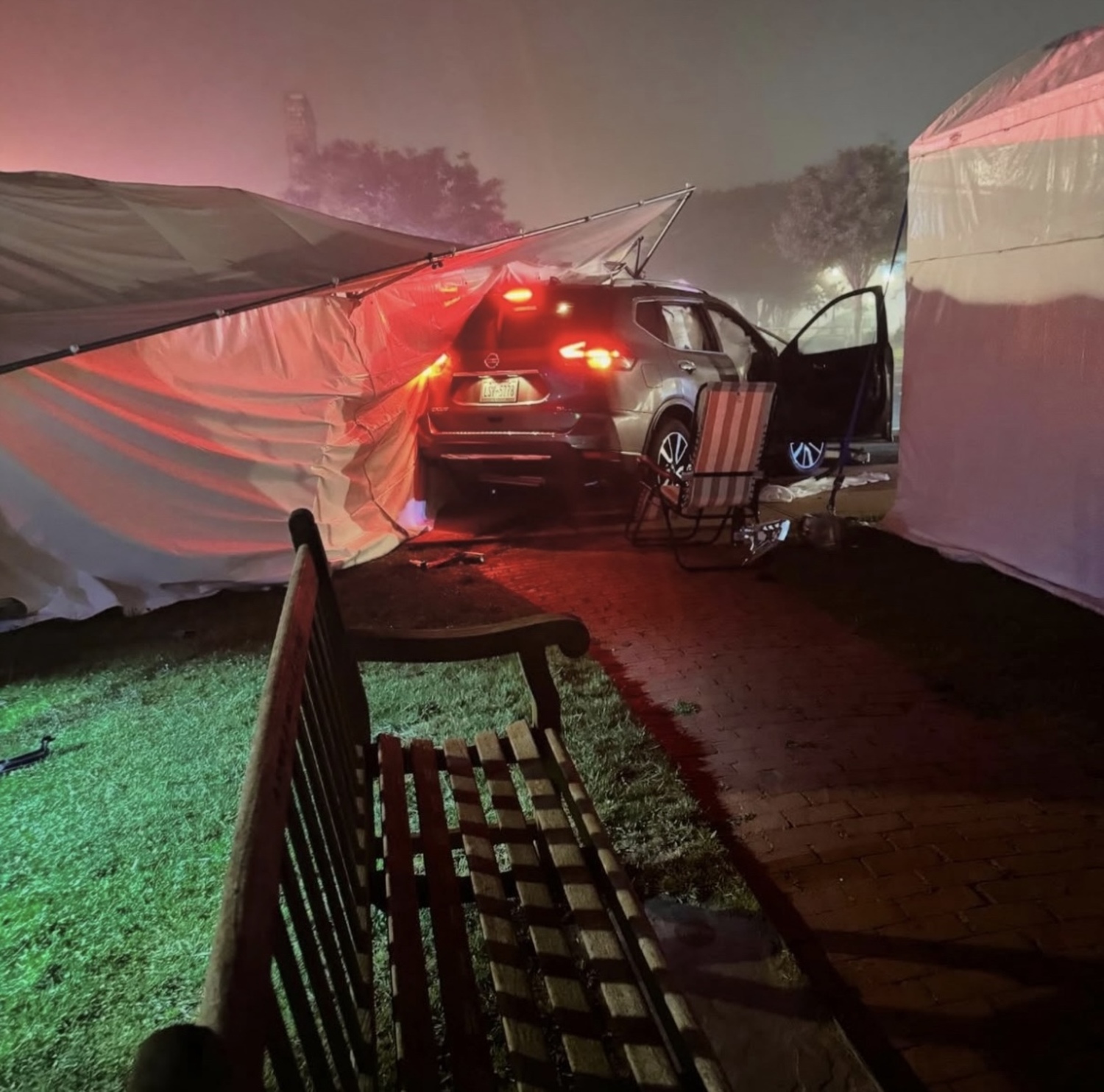 The car crashed through a guard rail at the end of South Emerson Street and took out several tents before crashing into a parked car owned by the security guards who were keeping watch over the art fair tents overnight.