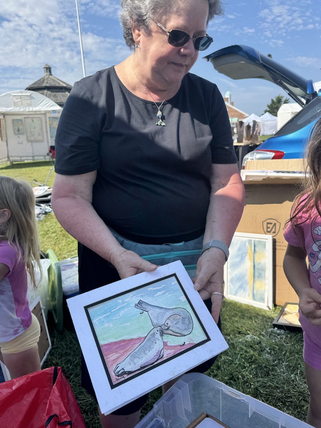 Watercolor artist Mary Planding said that this Montauk show was her first of the season and that many of her original pieces were destroyed. MICHAEL WRIGHT