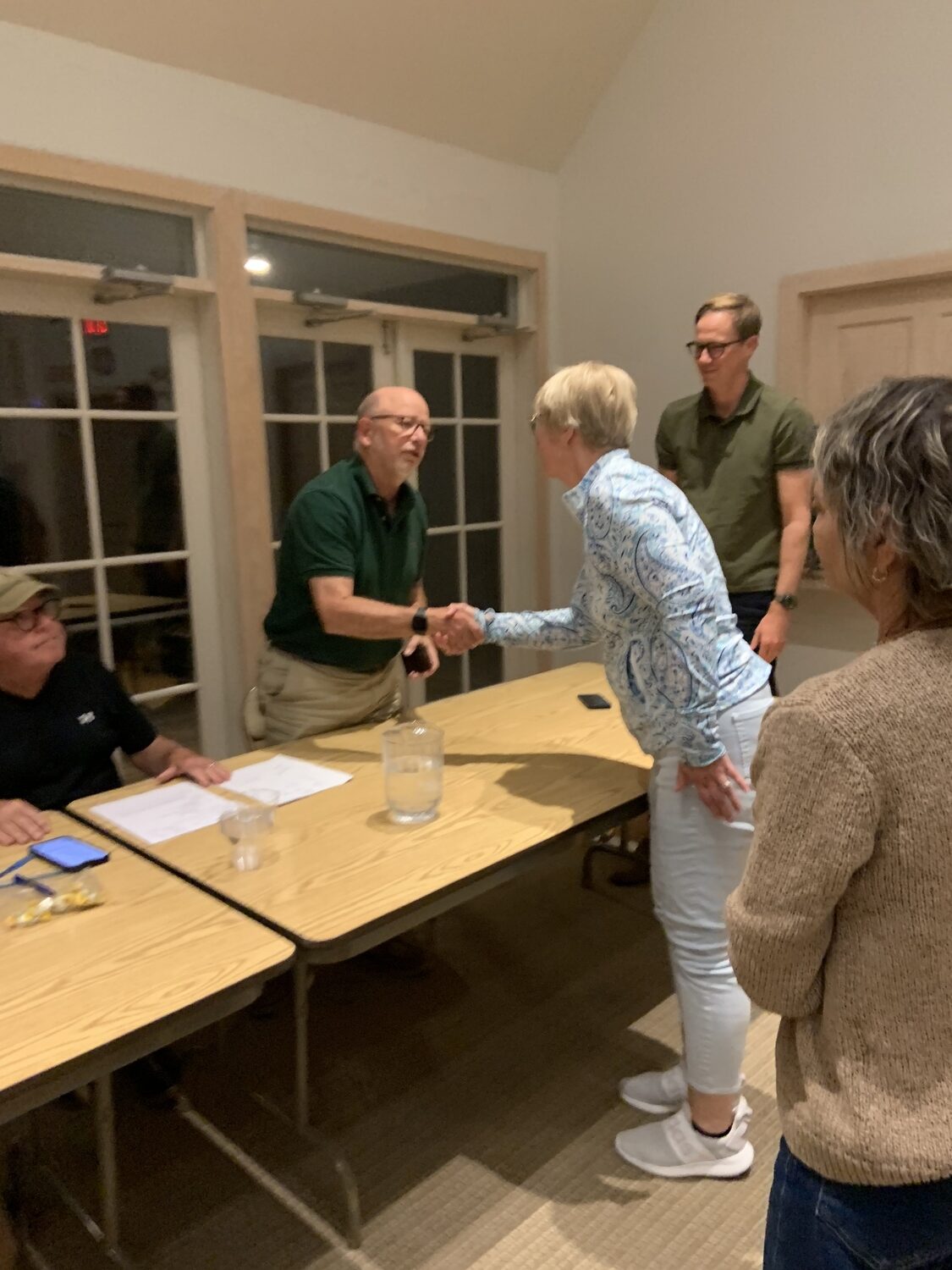 North Haven Trustee Terie Diat congratulates Trustee Peter Boody after Tuesday's election. STEPHEN J. KOTZ
