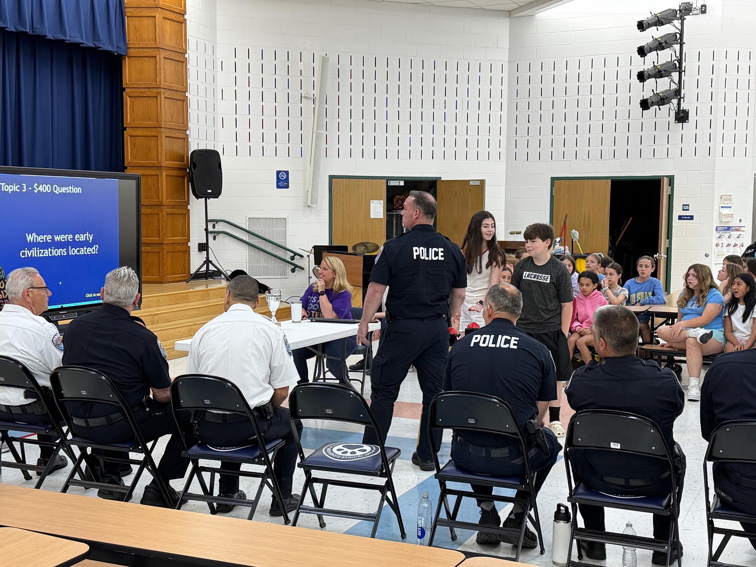 In the style of the popular show, East Quogue sixth graders put their academic skills
to the test in an annual fun-filled game of “Are you Smarter Than a Sixth Grader? The
gameshow guests were the members of the Southampton Police Department. COURTESY EAST QUOGUE SCHOOL DISTRICT
