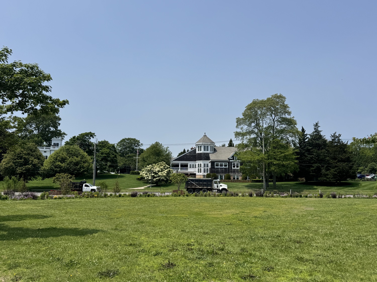 The Rogers Memorial Library and historic Cooper Hall overlook the parcel of preserved open space on Windmill Lane where a group of Southampton Village residents and officials have proposed moving the windmill at Stony Brook University-Southampton campus, which was originally in the village when it was built in the late 1600s or early 1700s.