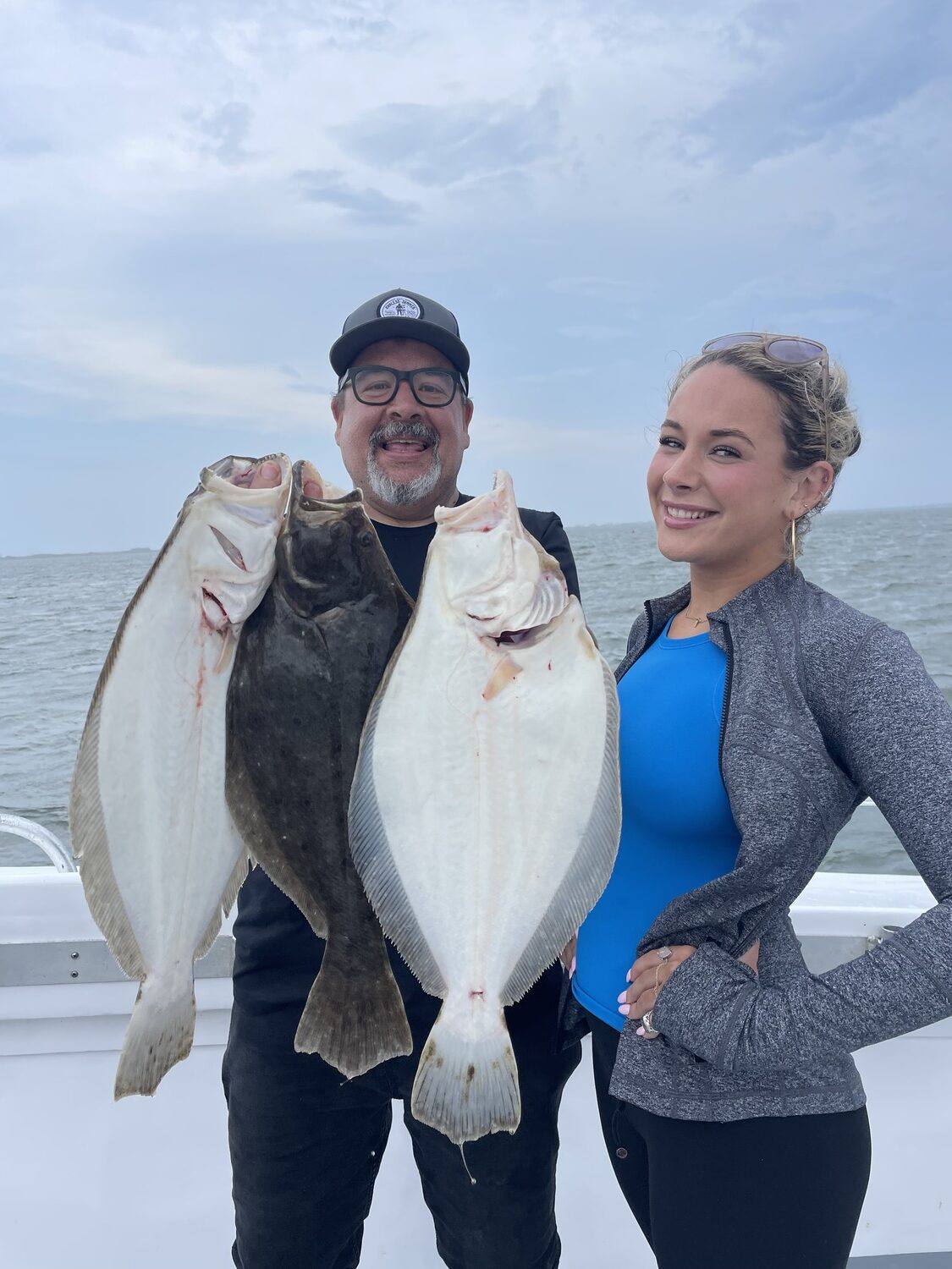 Peter and Emma Ambrose were out on the Hampton Lady for a daddy and daughters (Emma's sister Juliet was also aboard) fluke trip recently and went home with plenty of fluke for Pete's Endless Summer seasonings. COURTESY HAMPTON LADY FISHING