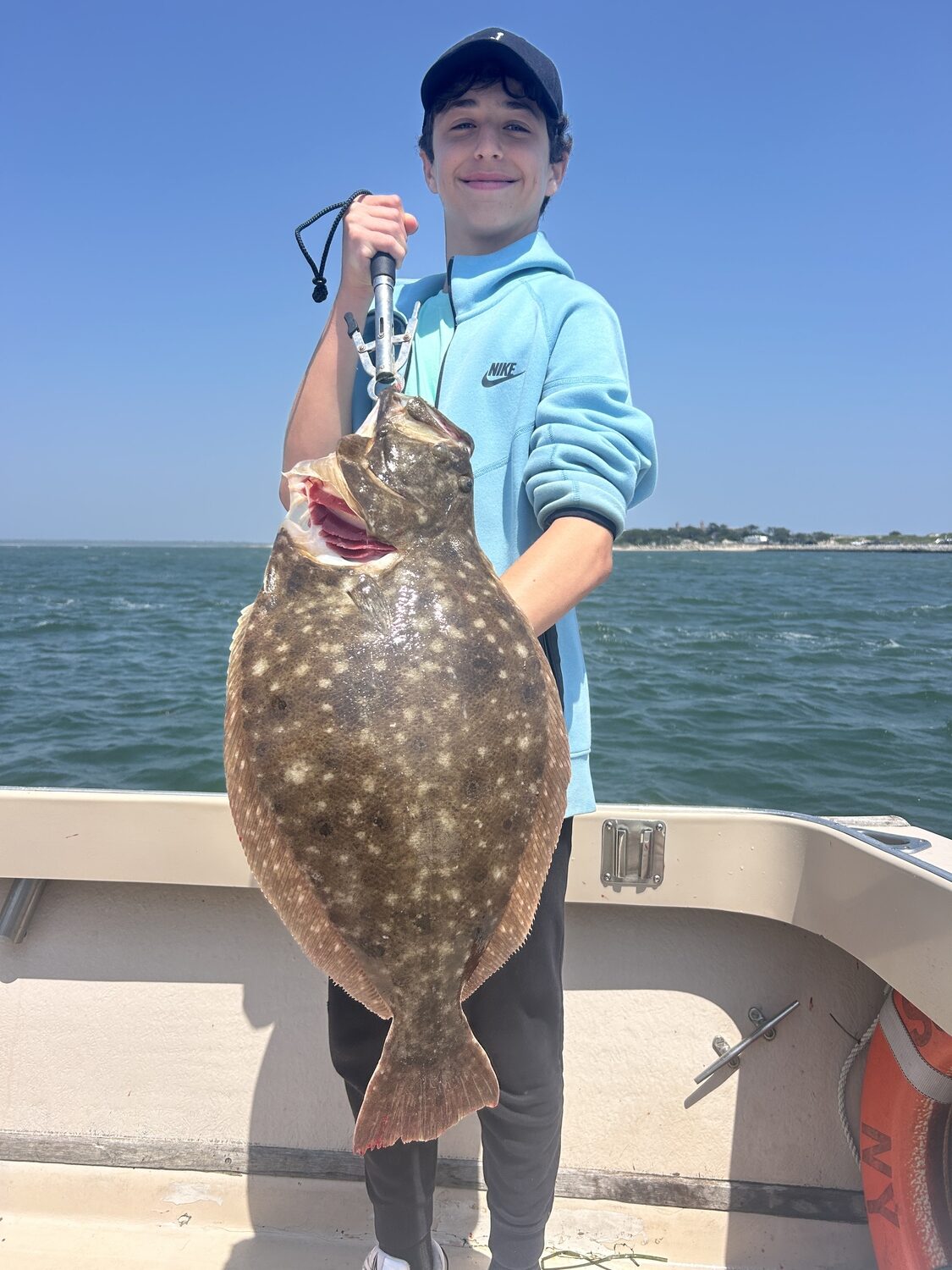 Jack Fuld decked this 10-pound doormat fluke while fishing aboard the Someday Came charter boat out of Hampton Bays recently. CAPT. BRAD RIES