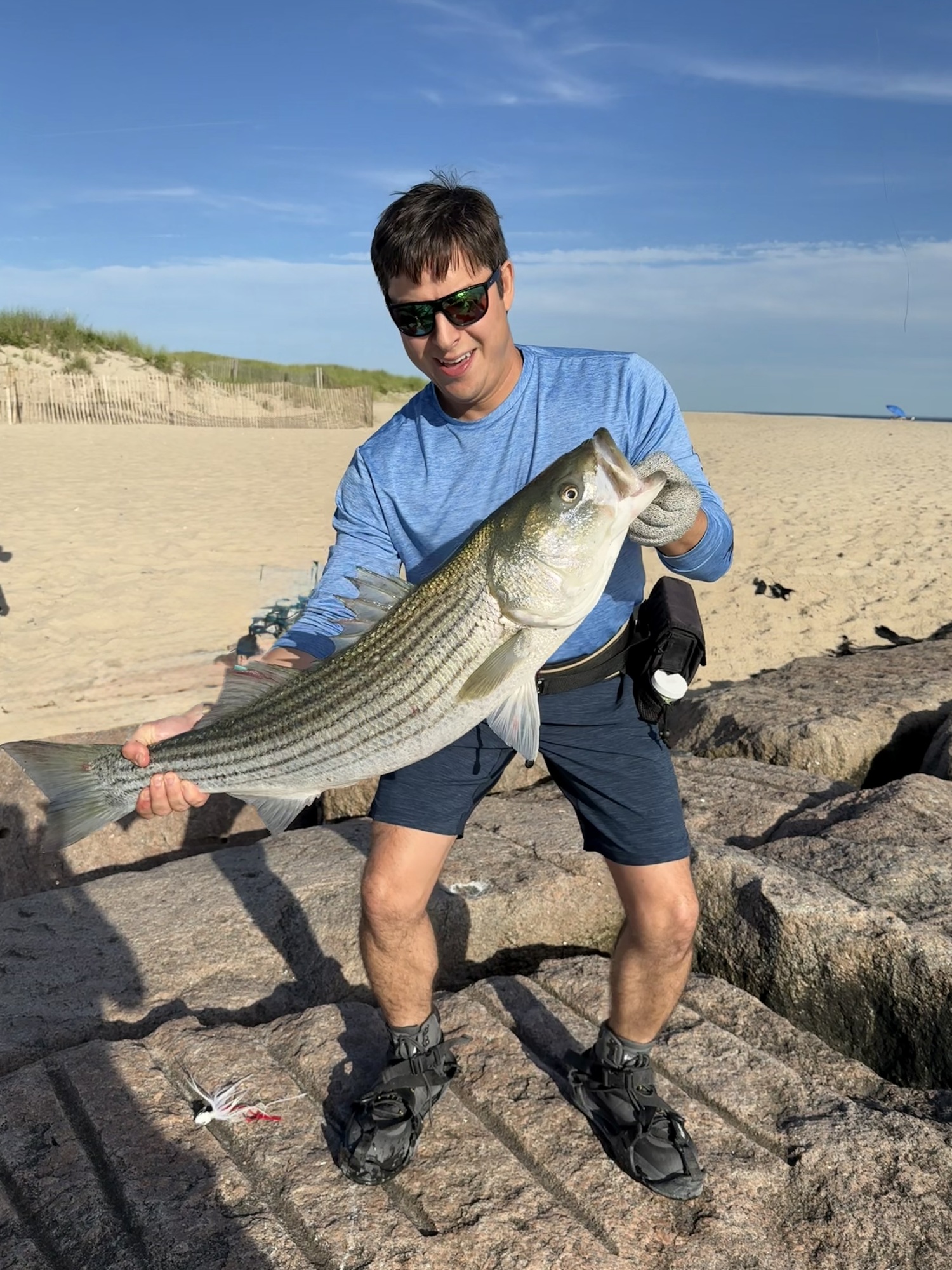 Think all the big bass have moved out of Shinnecock area for the summer? Think again. Derek de Svastich pulled this 40-incher onto the rocks at the inlet last week and got a quick pic before releasing.