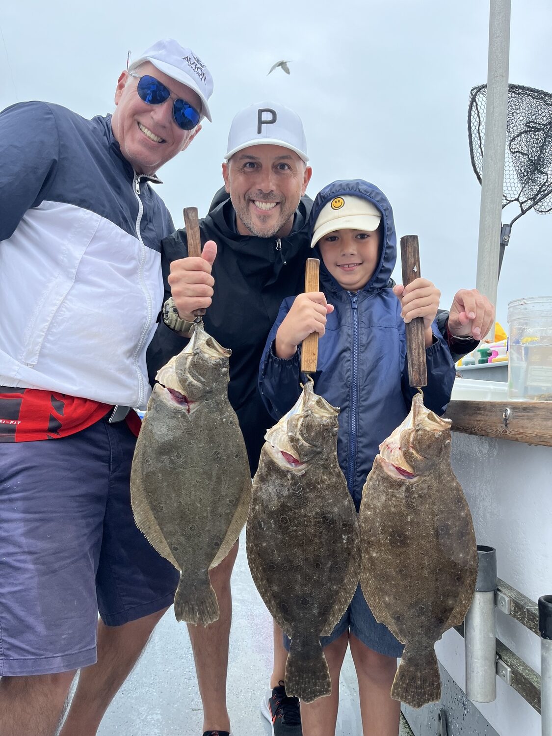 Three generations of Isidori's, Don, Joe and Roman, were aboard the Shinnecock Star last week to deck some big bay fluke with Capt. John and crew. CAPT. DEENA LIPPMAN