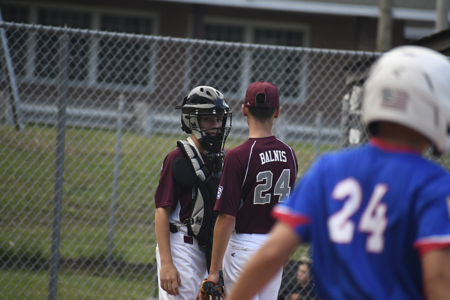 Catcher Jack Helfand speaks with pitcher James Balnis on Thursday, July 3.  DREW BUDD